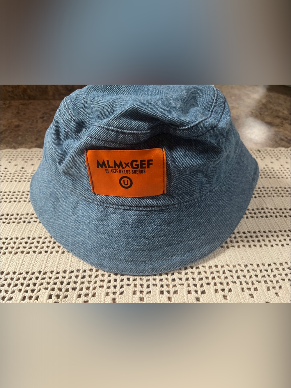 MLM x GEF Blue Denim Bucket Hat with Orange Patch el arte de los suenos new
